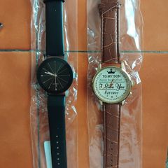 2 mens watches with leather straps.