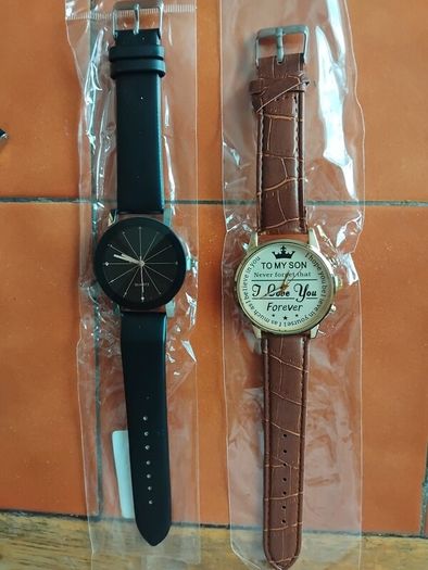 2 mens watches with leather straps.