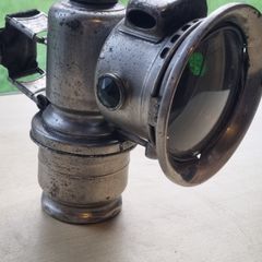 An antiqu Carbide (acetylene) lamp made by Joseph Lucas Ltd.