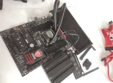 MSI X99A GAMING 7 Motherboard with extras including Triple pack Corsair cooler fans, VGA cables,thermal paste, installation guide & CD