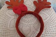 Reindeer antler headband with red bow