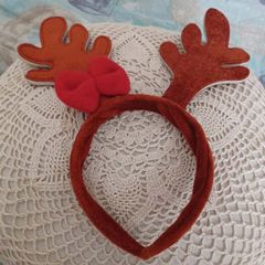 Reindeer antler headband with red bow