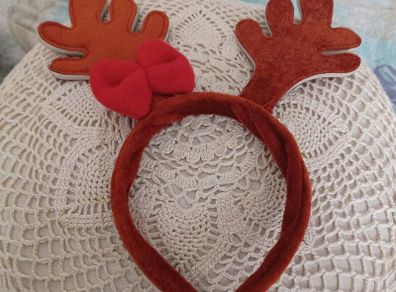 Reindeer antler headband with red bow
