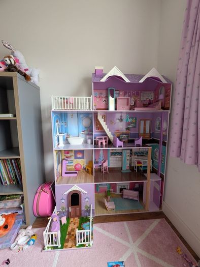 Large wooden dolls house with furniture