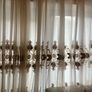 5 decorative pillows with a large beautiful laces curtain in brown and white colors Image 9