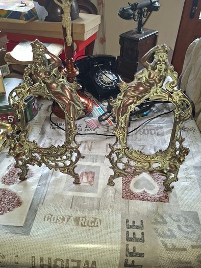 Beautiful Pair of Antique Art Nouveau Beatrice. Bronzed Photo Frames Cherub. a stunning lady lies on the top of the frame with beautiful scrollwork descending down the frame to a winged Cupid or Angel