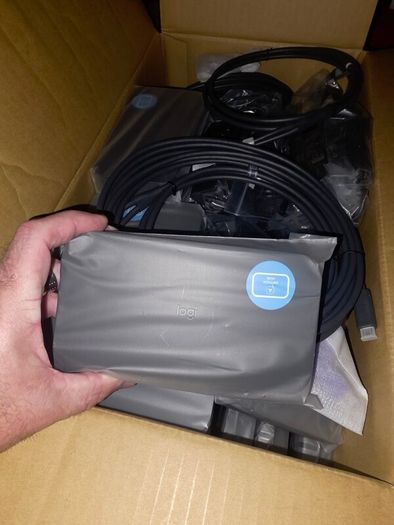 16 x Logitech Swytch Hubs. Includes power adapters and a few Extenders