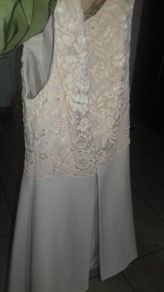 Beautiful salmon color dress, pretty lace on top with box pleat on front in mint condition only worn once on confirmation day.