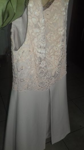 Beautiful salmon color dress, pretty lace on top with box pleat on front in mint condition only worn once on confirmation day.