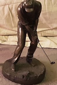 male golfing figure