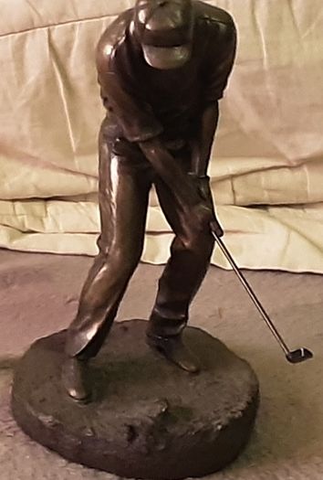male golfing figure