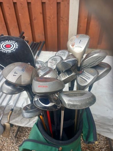 A selection of golf clubs and bags. Golf balls
