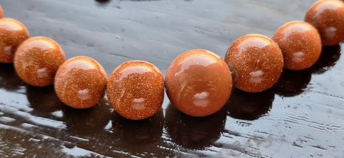 Gold sun stone necklace