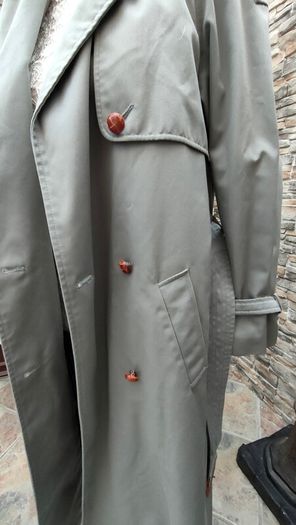 Vintage Nuage ladies trenchcoat Approximately late 90s early 00s Size 10 on label The colour is a pale bluey grey with brown buttons It's got an inner lining that can be removed