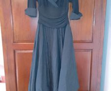 Elegant off-the-shoulder black evening gown.