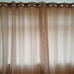 Textured light brown swirl patterned eyelet curtains from The Glenmount Collection made of polyester  size h 230cm, w 220cm (each)