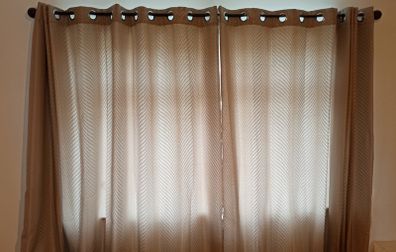 Textured light brown swirl patterned eyelet curtains from The Glenmount Collection made of polyester  size h 230cm, w 220cm (each)