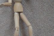Wooden poseable wooden figurine