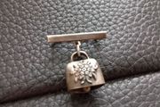 Cow bell brooch silver