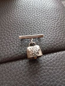 Cow bell brooch silver