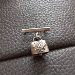 Cow bell brooch silver