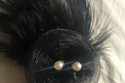feather brooch