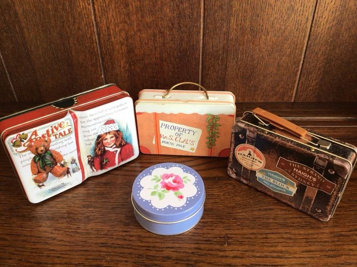 A collection of 4 Small tins