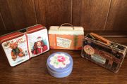 A collection of 4 Small tins