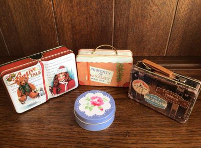 A collection of 4 Small tins