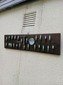 vintage sparkplug display board