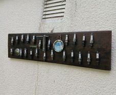 vintage sparkplug display board