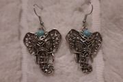 silvertone elephant head earrings