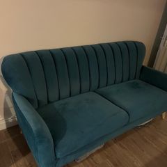 Teal green velvet sofa