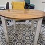 Round wooden dining table with white legs Image 2