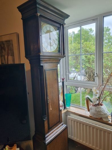 A Georgian grandfather clock made by the English clockmaker John Rogers of Leominster