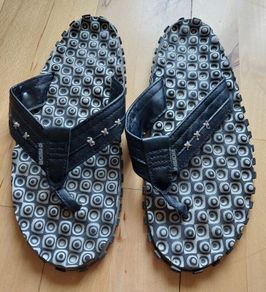 INSIDE brand flip flops with unusual surface