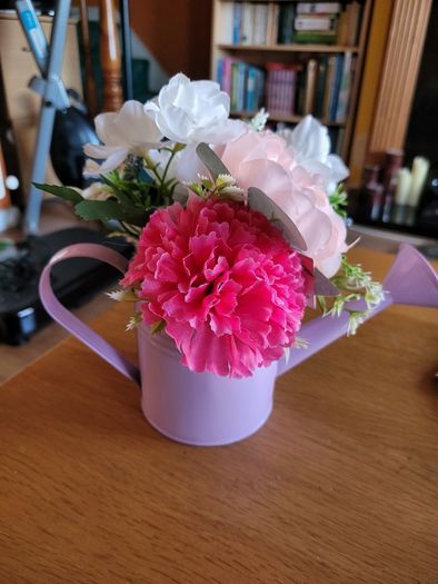 Artifical flowers in jug