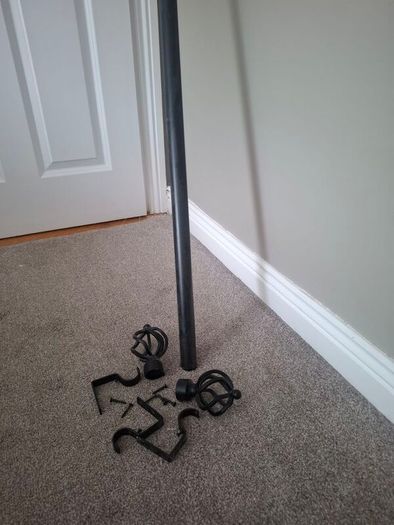 Black metal extendable curtain pole