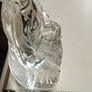 A glass Buddha figurine seated in the lotus position. Image 3