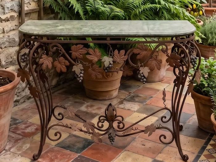 This old console table is handmade wrought iron