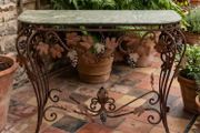 This old console table is handmade wrought iron
