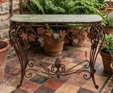 This old console table is handmade wrought iron