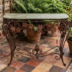This old console table is handmade wrought iron