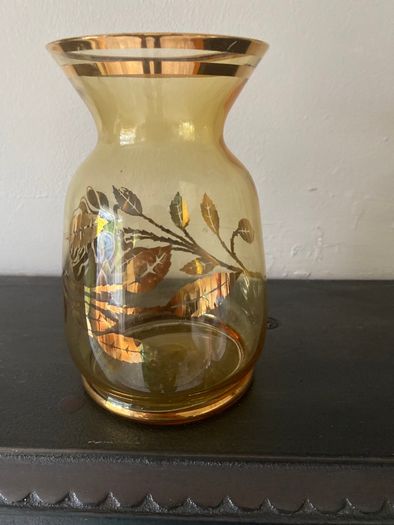 Vintage glass vase with gold decorations.