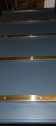 Chest drawers with brass strip suitcase set down