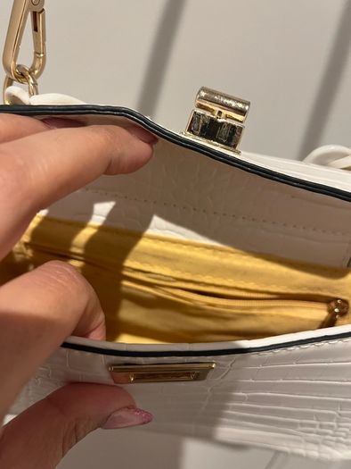 white leather hand bag
