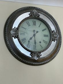 large silver mirror clock