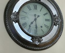 large silver mirror clock