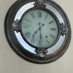 large silver mirror clock