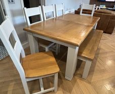 Large extendable 8 seater table with 5 chairs and a bench